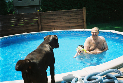 Rowdy guarding Jake in the pool with Grampa.  