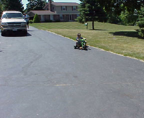 Nancy's drive was a big hit. The boys raced down the drive most of the afternoon. Nancy picked up several ride-on's at garage sales for the little guys.